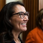 Mary Peltola smiles as she participates in a swearing-in ceremony with Speaker of the House Nancy Pelosi.