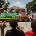 Spectators watch a Juneteenth Parade on June 19, 2021 in Galveston, Texas.