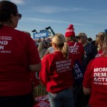 Several people wearing red shirts with the words 