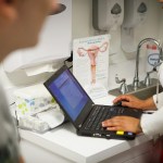 A nurse speaks with a patient at a clinic in Houston, Texas.