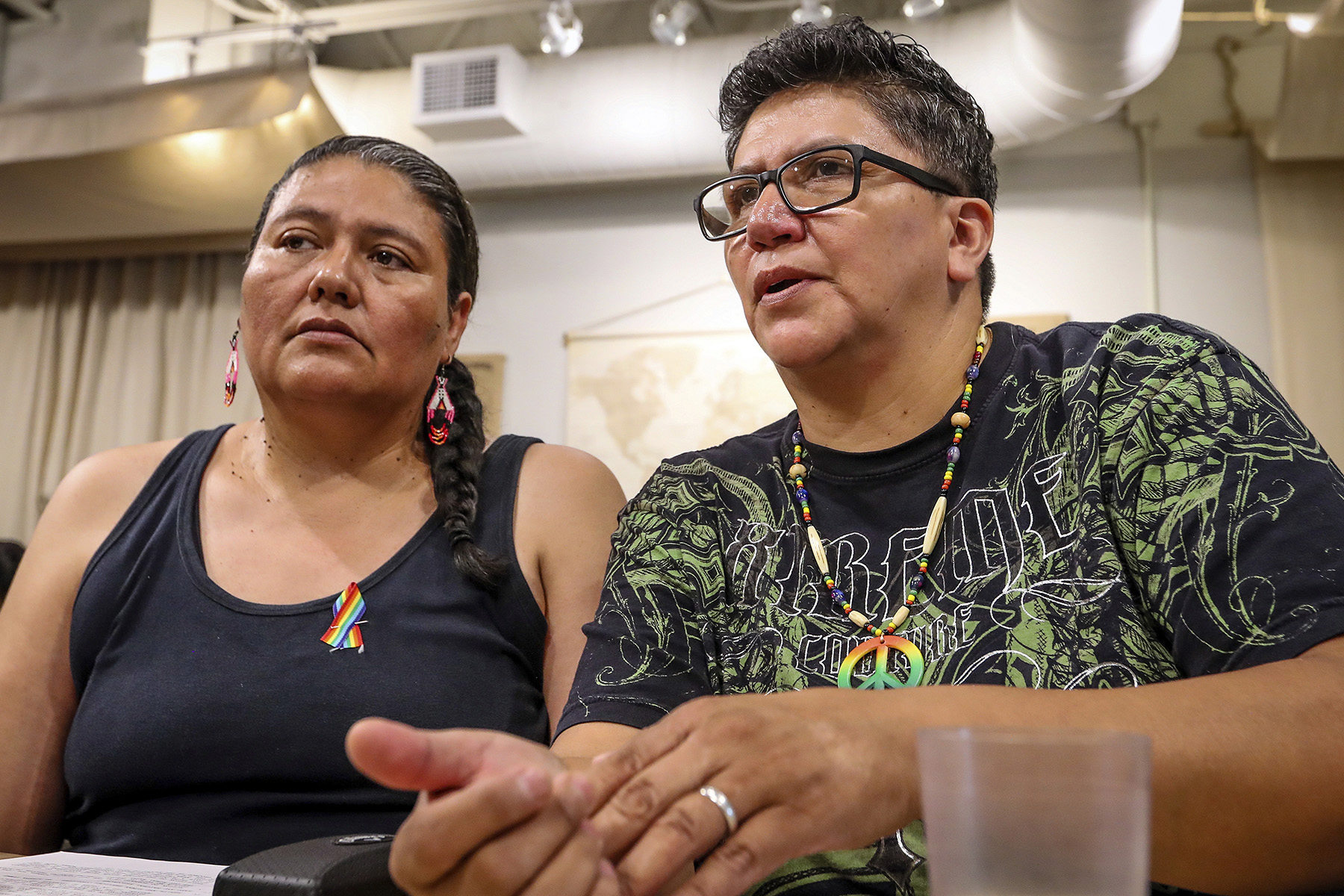 Two women sit together.